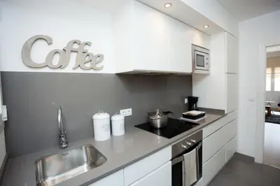 a kitchen with a sink and a counter top at Charming & Quiet Park Guell Apartment in Barcelona