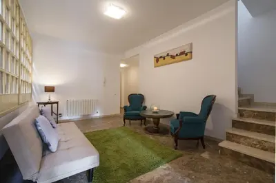a living room with a couch and chairs and a table at Holiday home Splendid Park Güell in Barcelona