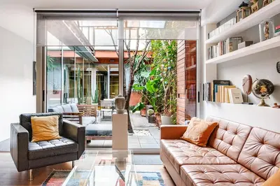 a living room with a couch and two chairs at ArtlifeBCN Fira Apartment in Barcelona