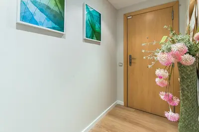a hallway with a door with pink flowers in it at Top family apartment by Lofties in Terrassa