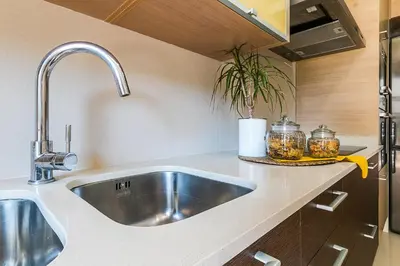 a kitchen with a stainless steel sink and a counter at Top family apartment by Lofties in Terrassa