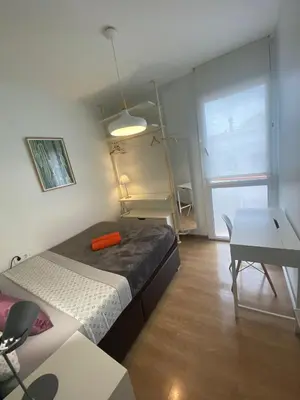 a living room with a couch and a table at Palau Rooms in Barcelona