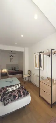 a small kitchen with a refrigerator and a sink at Palau Rooms in Barcelona