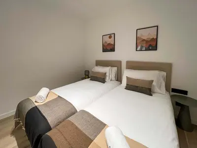 two beds sitting next to each other in a bedroom at Stay U-nique Apartments Putxet in Barcelona