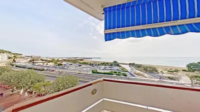 a view of the beach from the balcony of a building at Premium Habitat Del Far in Arenys de Mar