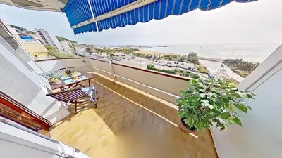 a balcony with a table and a view of the ocean at Premium Habitat Del Far in Arenys de Mar