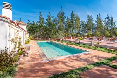a swimming pool in the backyard of a house at Gallinero - Familienfreundliches Appartment in Katalanischer Masia in Sant Iscle de Vallalta