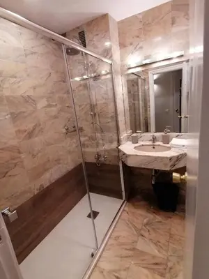 a bathroom with a shower and a sink at Corcega - Sagrada Familia in Barcelona
