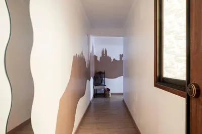 a hallway with white walls and a window at Apartamento 3 hab 15 minutos de Barcelona centro y 5 minutos playa in Sant Adria de Besos