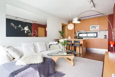 a living room with a white couch and a table at My Space Emirates - Executive Apartments with Private Balcony in Barcelona