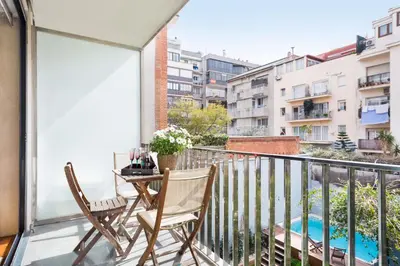 a balcony with two chairs and a table at My Space Emirates - Executive Apartments with Private Balcony in Barcelona