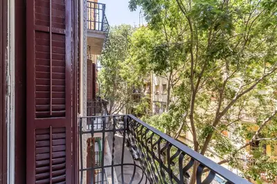 an apartment balcony with a view of a street at AB Margarit Apartments in Barcelona