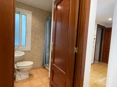 a bathroom with a toilet and a sink at Apartment Picasso in Vilanova i la Geltrú