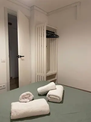 two towels sitting on a table in a room at Barri Vell 4 in Manresa