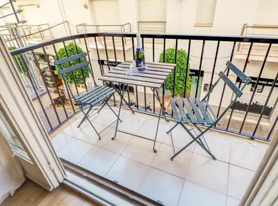 a table and two chairs on a balcony at Araia Apartment by Hello Homes Sitges in Sitges