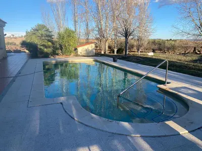 a swimming pool in the middle of a street at La Geneta Casa Vacacional in Vilobi Del Penedes