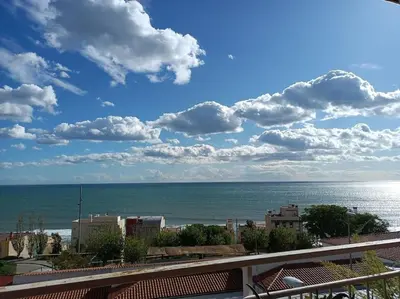 a view of the ocean from a balcony at Apartamento al lado de Barcelona y la playa in Montgat