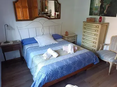 a bedroom with a bed with towels on it at Apartamento al lado de Barcelona y la playa in Montgat