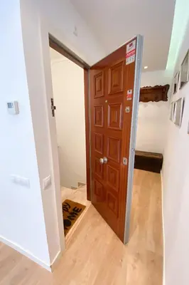a door leading into a room with a hallway at Anna & Thomas - Sitges Center Apt in Sitges