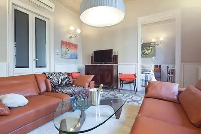 a living room with a couch and a glass table at My Space Emirates - Apartments in Rambla de Catalunya in Barcelona