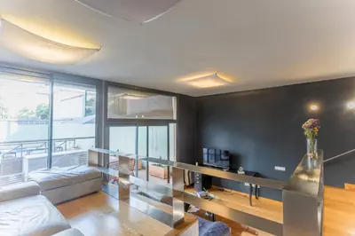 a living room with a couch and a table at My Space Emirates - Bright Apartment in Gracia with shared Pool in Barcelona