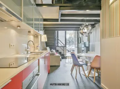 a kitchen with a sink and a table with chairs at Alcam Futbol Pequeño in Barcelona