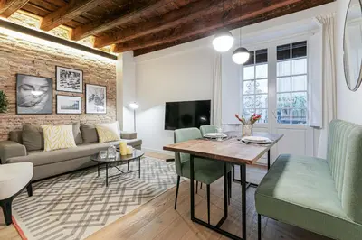 a living room with a couch and a table at CATERINA Correos in Barcelona