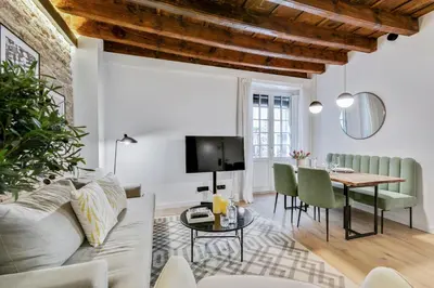 a living room with a couch and a table at CATERINA Correos in Barcelona