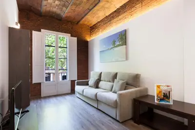 a living room with a couch and a table at 2512 - AB Comte dUrgell P-II in Barcelona