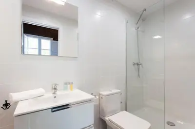 a bathroom with a toilet and a sink and a shower at 2512 - AB Comte dUrgell P-II in Barcelona