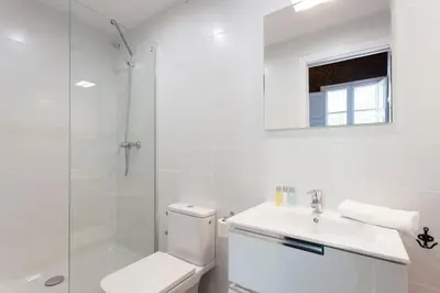 a bathroom with a toilet and a sink and a shower at 2513 - AB Comte dUrgell II-I in Barcelona