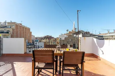 a table and chairs sitting on a balcony at 2514 - AB Comte dUrgell V-II in Barcelona