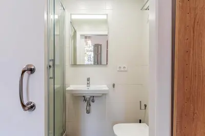 a bathroom with a sink and a glass shower at 4190 - AB Comte dUrgell P-I in Barcelona