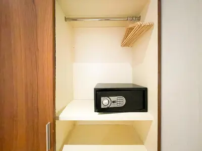 a small microwave sitting on a shelf in a closet at Boutique Pare Lainez in Barcelona