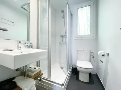 a bathroom with a sink and a toilet and a shower at Boutique Pare Lainez in Barcelona