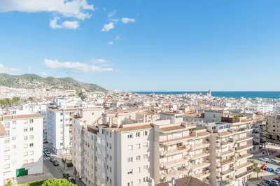 an aerial view of a city with buildings at Horizonte Azul Sitges in Sitges