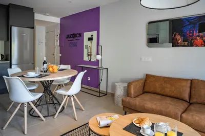 a living room with a couch and a table at Habitat Apartments Free Jazz in Barcelona