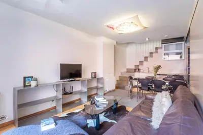 a living room with a couch and a table at My Space Emirates - Fully equipped apartments near the Beach with shared pool in Barcelona