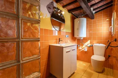 a bathroom with a toilet and a sink at Apartamento La boqueria Atic in Barcelona