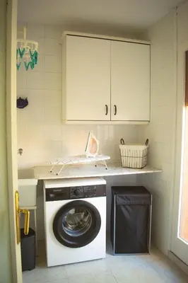 a kitchen with a washing machine in a kitchen at Espectacular Casa en La Garriga in La Garriga