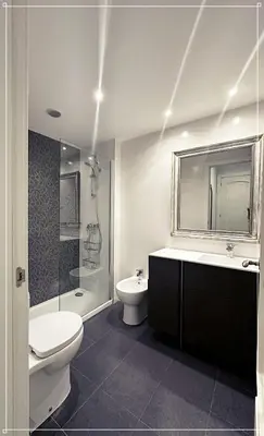 a bathroom with a toilet and a sink and a shower at FIRA GRAN VIA II in Hospitalet de Llobregat
