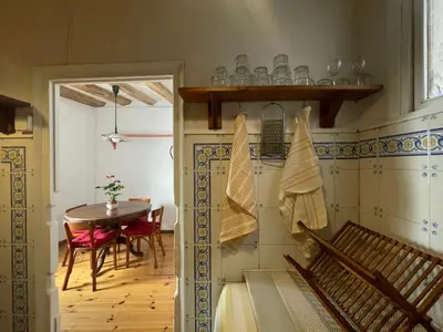 a room with a table and a dining room at Original duplex in the center of Barcelona in Barcelona