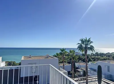 a view of the ocean from the balcony of a condo at Duplex vistas mar con piscina in Sant Pere de Ribes