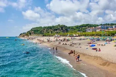 a group of people on a beach with the ocean at Holiday home in Calella de la Costa 3641 in Calella