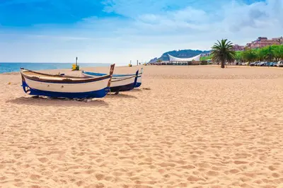 a boat sitting on the sand on a beach at Holiday home in Calella de la Costa 3641 in Calella