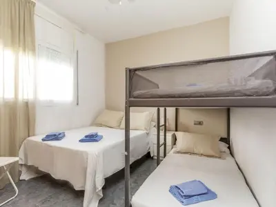 two bunk beds in a room with a window at Holiday Home Villa Rosales by Interhome in Gornal