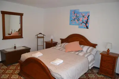 a bedroom with a bed with two towels on it at Casa Cal Tòfol in Font-Rubí