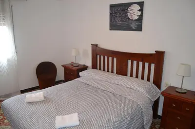 a bedroom with a bed with two towels on it at Casa Cal Tòfol in Font-Rubí
