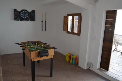 a room with a chess board on a table at Casa Cal Tòfol in Font-Rubí