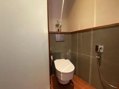 a small bathroom with a toilet in a room at Luminous Designer Loft Style Apt Eixample Views By MyRentalHost in Barcelona